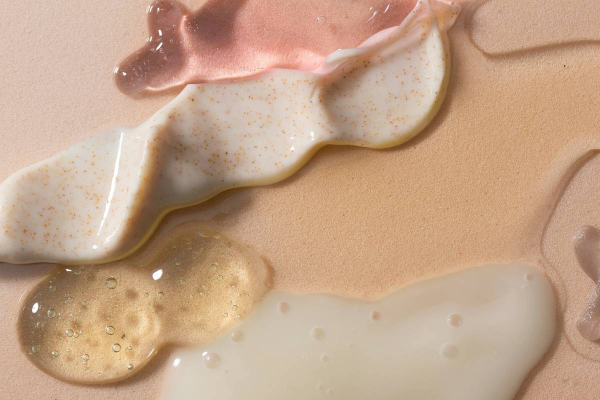 dermatologist applying gentle glycolic acid peel during in-office treatment, showing even application to cheek and jawline — glycolic acid benefits for skin care